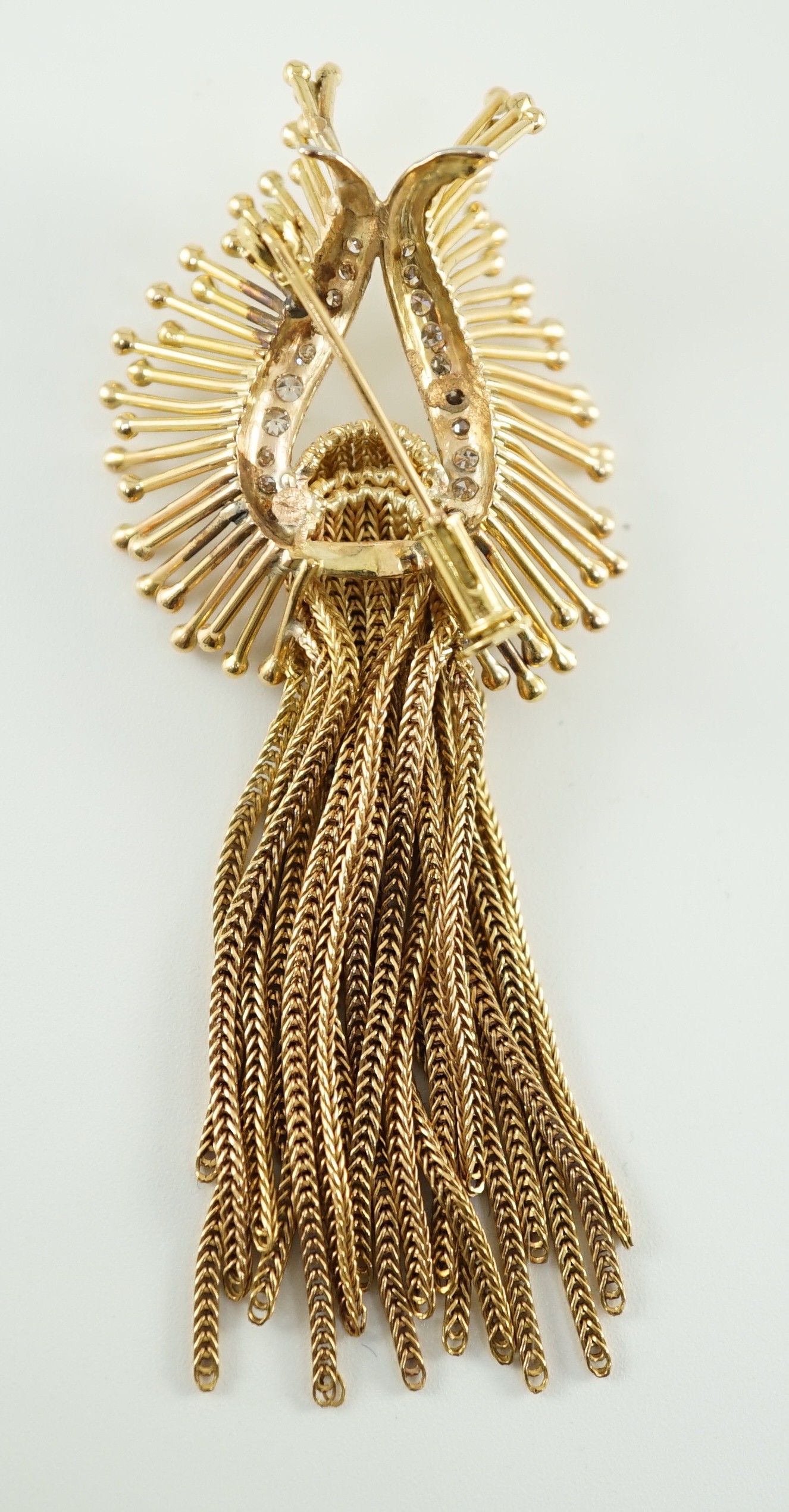 A late 20th century stylish continental gold and diamond cluster set tassel brooch